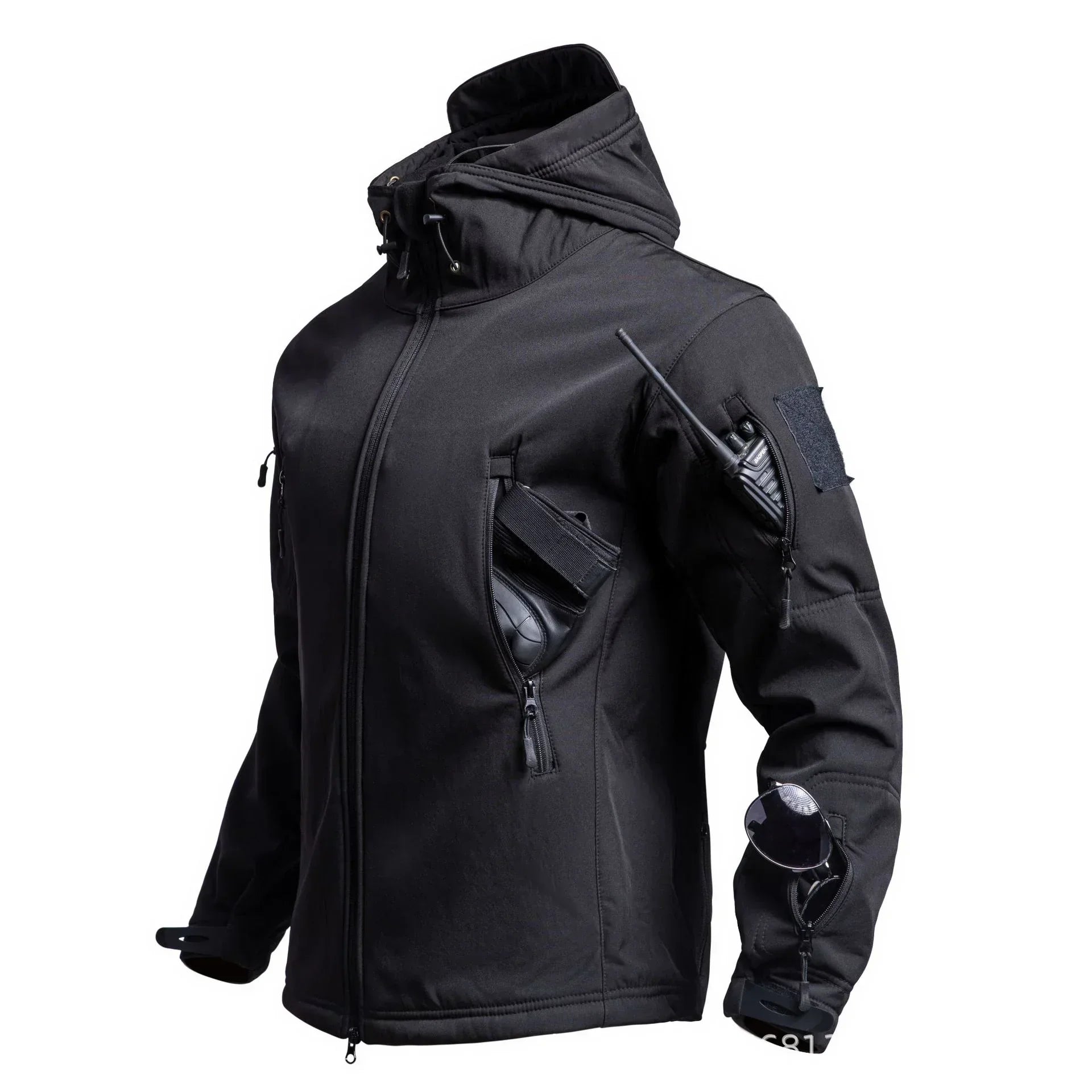 Black tactical softshell jacket with hood, zip pockets, utility fit, and sleek streetwear style