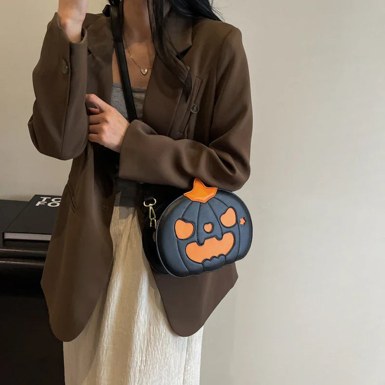 Woman in a brown blazer with a black and orange pumpkin-shaped crossbody bag, casual streetwear.