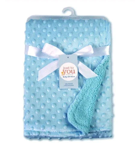 Light blue textured fleece baby blanket with satin ribbon, plush and soft material