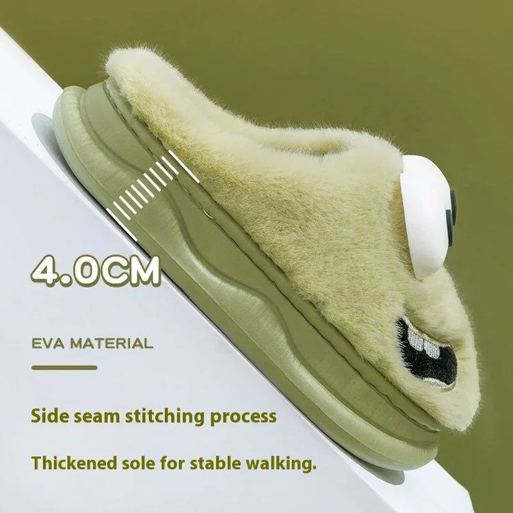 Fuzzy beige slipper with thick olive green EVA sole, cartoon embroidery, and stable fit.