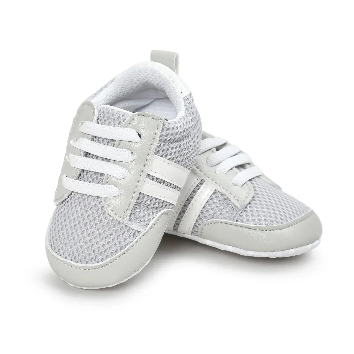 Gray mesh baby sneakers with white faux leather accents and laces, sporty design