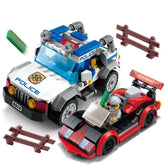 Plastic building block toy police vehicle and red sports car with mini figures and road barriers