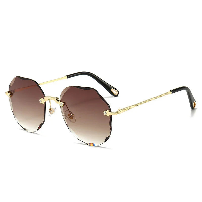 Geometric rimless sunglasses with gold metal arms and brown gradient lenses