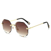 Geometric rimless sunglasses with gold metal arms and brown gradient lenses