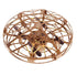 Gold metallic drone with cage design and black propellers, futuristic tech gadget