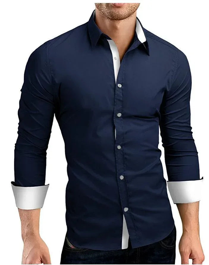 Slim fit navy blue dress shirt with white collar and cuffs, long sleeves, button-up style