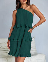 Woman wearing green one-shoulder pleated ruffle mini dress with relaxed fit