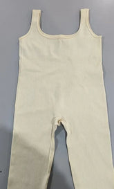 Beige ribbed knit jumpsuit with wide straps, sleeveless, slim fit streetwear style.