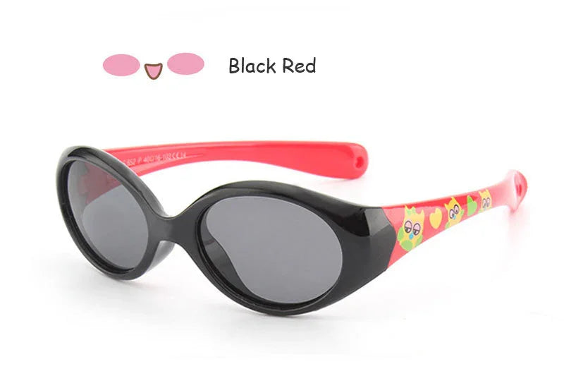 Oval black and red sunglasses with glossy plastic frame, cartoon print arms, and dark lenses