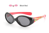 Oval black and red sunglasses with glossy plastic frame, cartoon print arms, and dark lenses