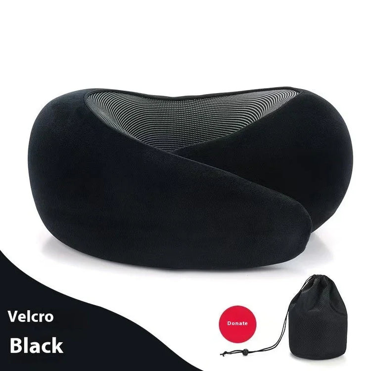 Black ergonomic travel neck pillow with soft velvety fabric and mesh lining, includes storage bag
