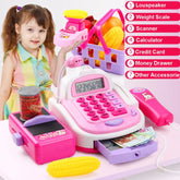 Girl in pastel plaid sleeveless dress with pleated skirt, sitting and playing with a pink and purple toy cash register set.