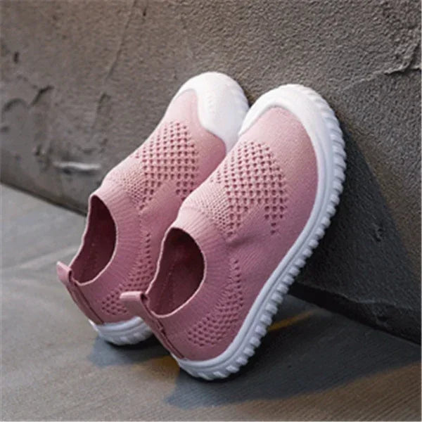 Pink knit slip-on sneakers with white soles, breathable mesh texture, casual fit