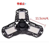 Black adjustable LED garage light with three foldable panels, measured at 11.5 cm each