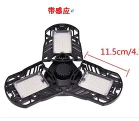 Black adjustable LED garage light with three foldable panels, measured at 11.5 cm each