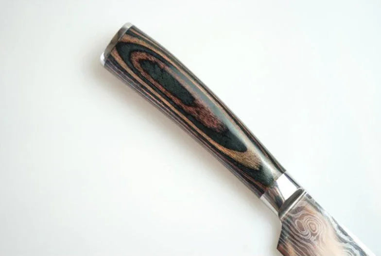 Close-up of a knife with a polished, dark wood grain handle and metal bolster