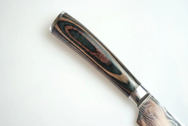 Close-up of a knife with a polished, dark wood grain handle and metal bolster