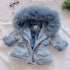 Light blue denim jacket with faux fur lining and hood, relaxed fit, winter casual style