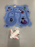 Blue space-themed kids puzzle mat with cartoon astronauts, aliens, rockets, and a toy airplane.