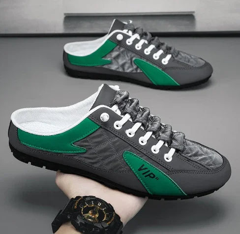 Gray and green low-top streetwear sneakers with white laces and slip-on fit