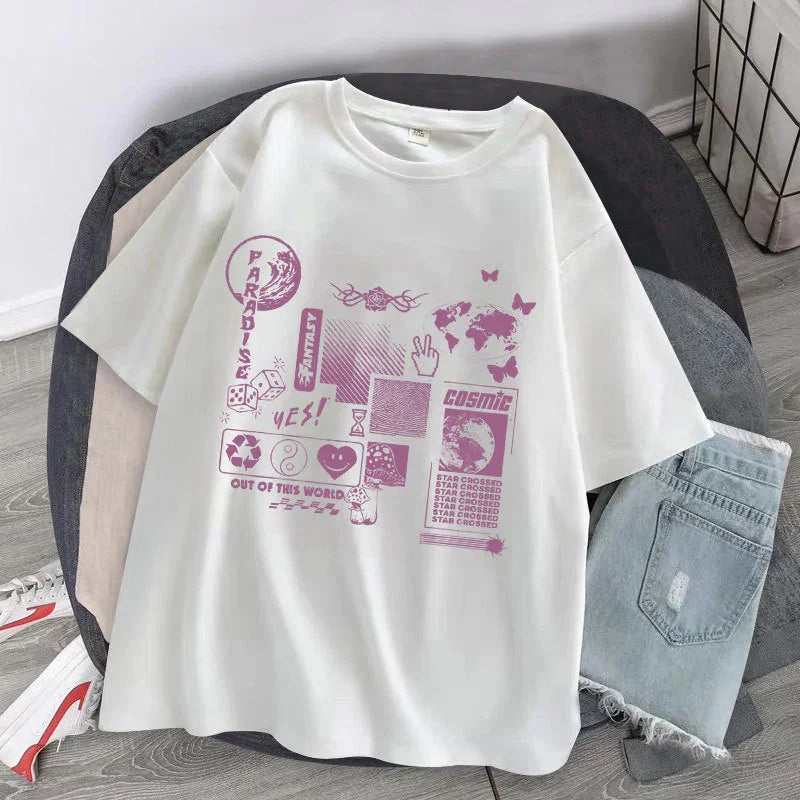 White oversized graphic tee with purple futuristic designs, paired with light denim shorts