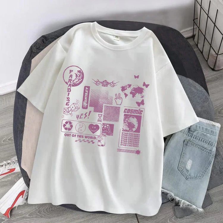 White oversized graphic tee with purple futuristic designs, paired with light denim shorts