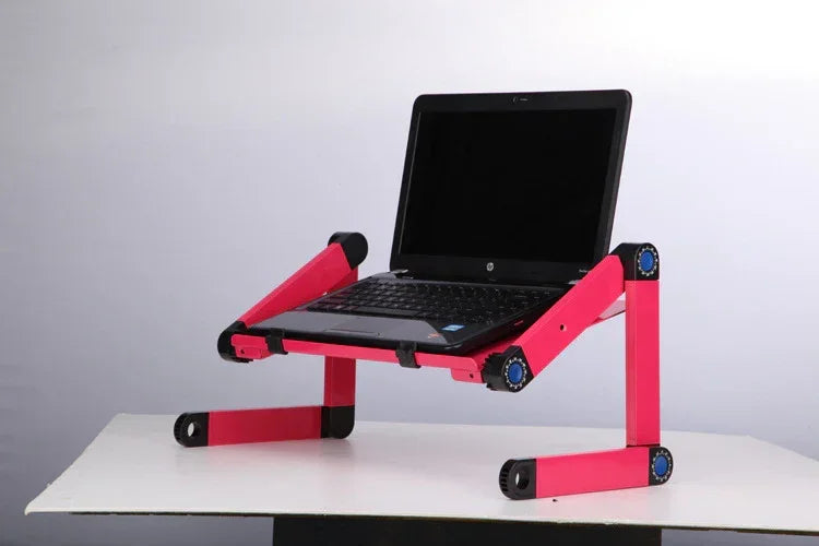 Adjustable pink aluminum laptop stand with foldable legs on a white surface