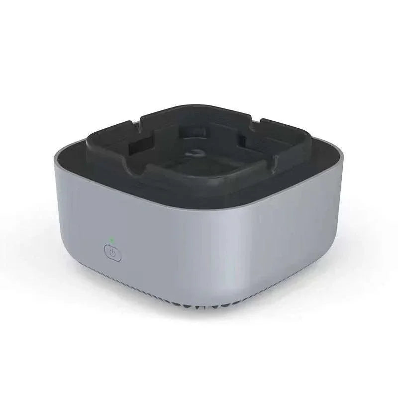 Silver and black tech accessory with power button, modern minimalist design