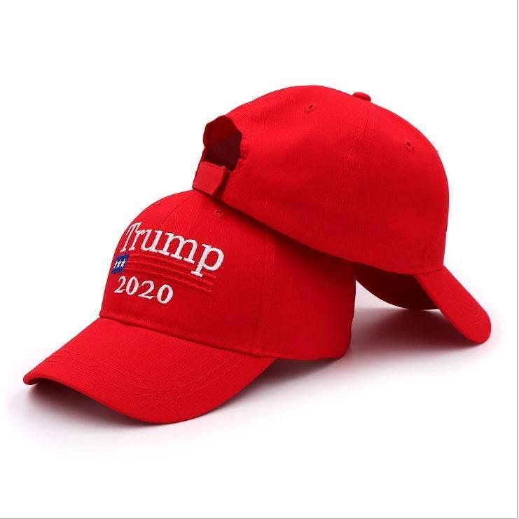 Bright red cotton baseball caps with curved brim, white embroidered text, adjustable fit.
