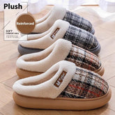 Cozy plaid slip-on slippers with plush lining and thick reinforced sole on wooden floor