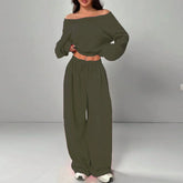 Woman wearing olive green off-shoulder long sleeve crop top and wide leg pants set
