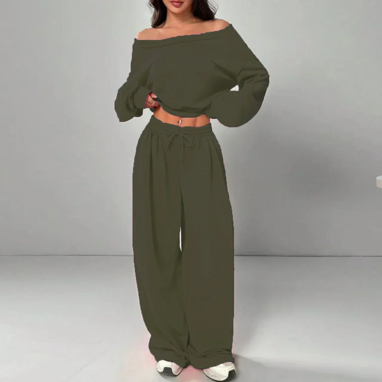 Woman wearing olive green off-shoulder long sleeve crop top and wide leg pants set