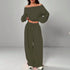 Woman wearing olive green off-shoulder long sleeve crop top and wide leg pants set