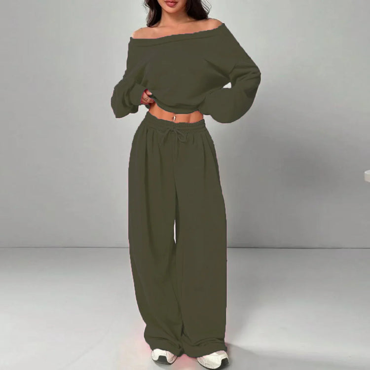Woman wearing olive green off-shoulder long sleeve crop top and wide leg pants set