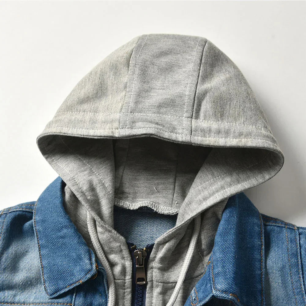 Gray cotton hood attached to blue denim jacket with zip-up front, casual streetwear style.