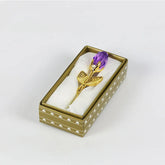Gold-plated rose brooch with purple crystal bud in a decorative gift box