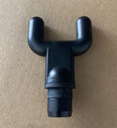 Black plastic Y-shaped massage gun attachment on a brown background