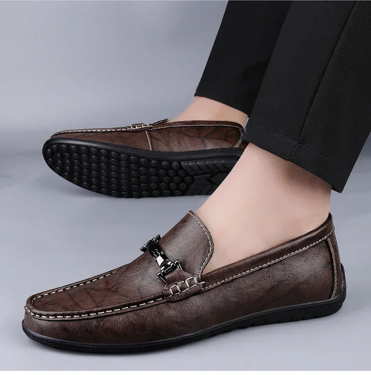 Men's brown leather loafers with black metal buckle, slip-on, casual fit