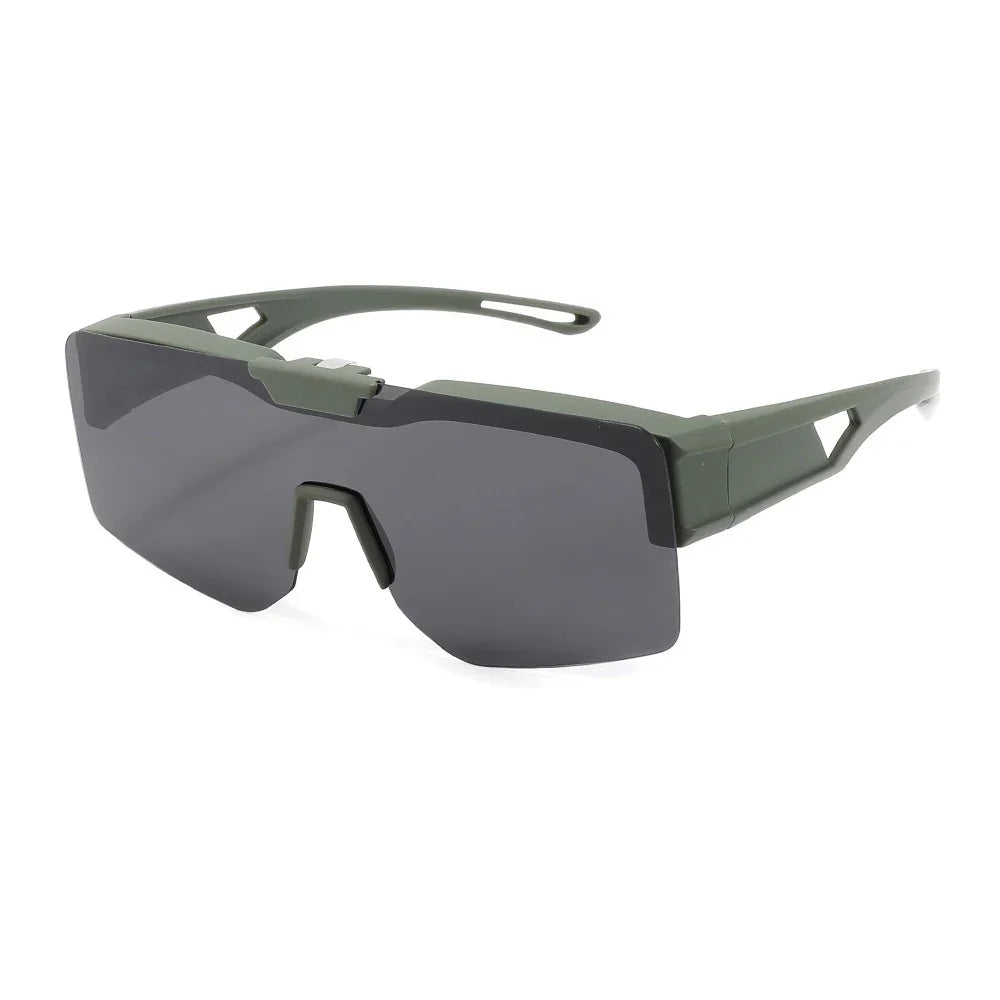 Futuristic streetwear sunglasses with angular dark lenses, green frame, wide fit