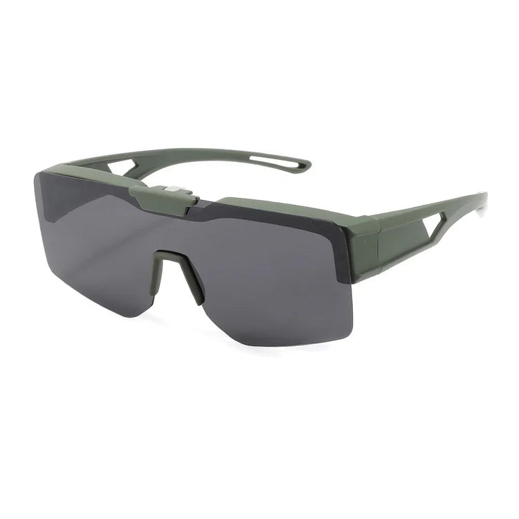 Futuristic streetwear sunglasses with angular dark lenses, green frame, wide fit