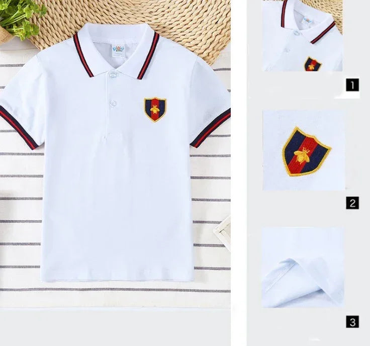 White short-sleeve polo shirt with striped collar, embroidered crest patch, cotton material, slim fit.