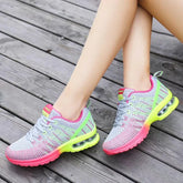 Gray mesh sneakers with neon pink and yellow accents, air sole, lightweight athletic fit