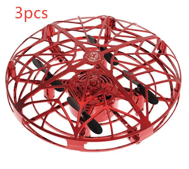 Red metallic drone toy with cage-style propeller guard, spherical design, compact size