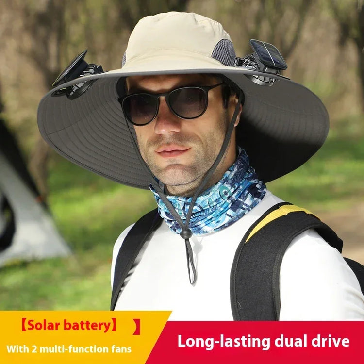 Man wearing a wide-brimmed beige sun hat with solar-powered fans, UV-protective fabric, and a blue patterned neck gaiter outdoors.