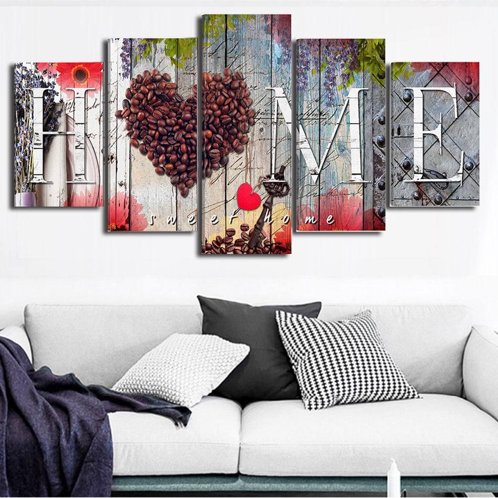Modern living room with light gray sofa, black and white throw pillows, and abstract wall art.
