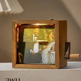 Wooden music box with a vintage wedding scene photo, dressed in formal attire.