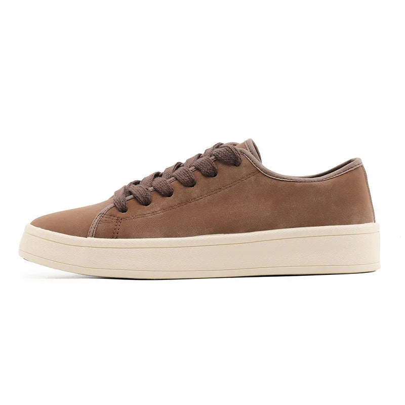 Brown suede low-top sneaker with beige rubber sole, minimalist streetwear style