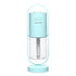 Modern light blue portable humidifier with clear water tank and minimalist design