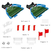 Mini soccer game set with green half fields, red handles, white side doors, football goals, small soccer balls, red flagpoles, and rubber bands.
