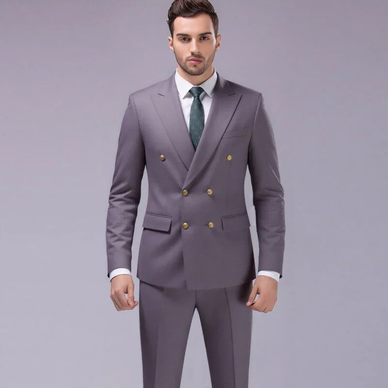 Slim fit double-breasted gray suit with gold buttons, white shirt, and green tie